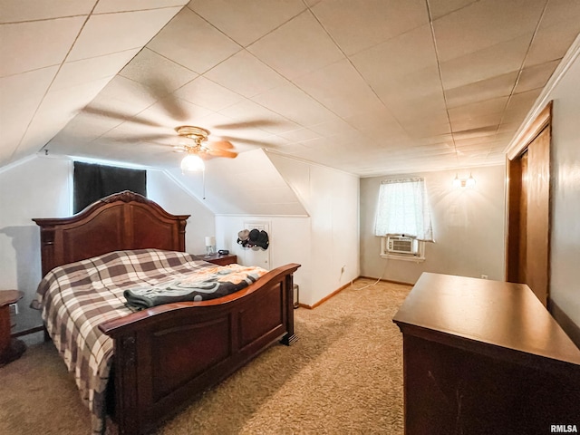 carpeted bedroom featuring cooling unit, vaulted ceiling, and ceiling fan