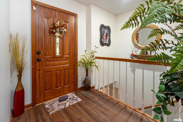 entrance foyer featuring dark hardwood / wood-style floors