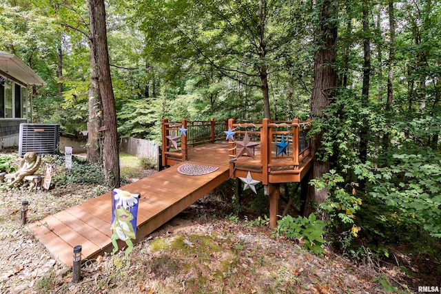 wooden terrace featuring central AC unit