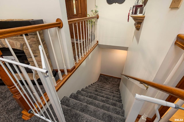 stairway featuring carpet floors