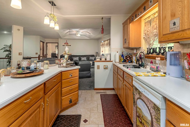 kitchen featuring ceiling fan, hanging light fixtures, backsplash, plenty of natural light, and dishwasher