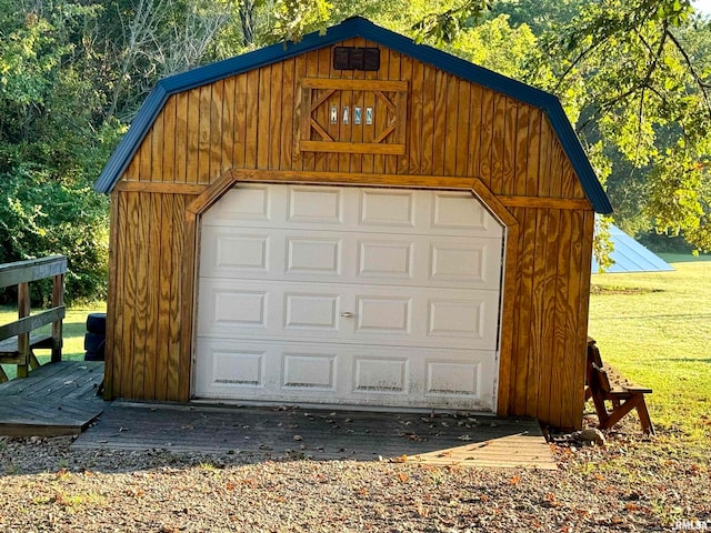 garage featuring wooden walls