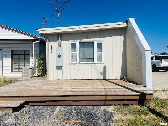 view of front of home featuring central AC and a wooden deck