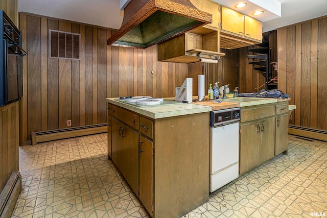 kitchen featuring black oven, premium range hood, wooden walls, and baseboard heating