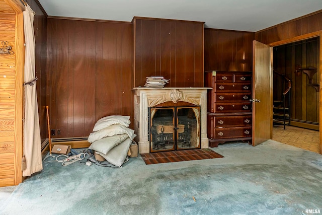 living room with wood walls and carpet flooring