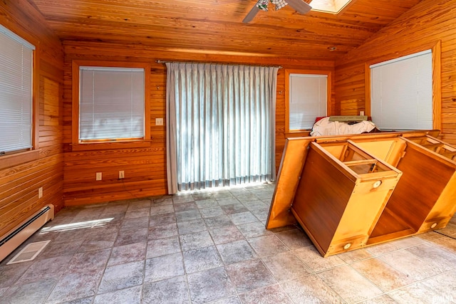 interior space with wooden ceiling, wooden walls, and baseboard heating