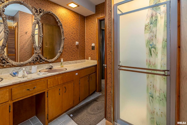 bathroom with vanity and tile patterned flooring