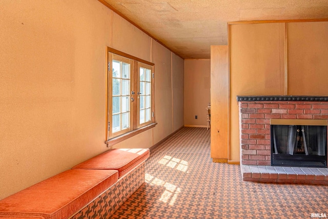 interior space featuring a textured ceiling, a fireplace, and carpet