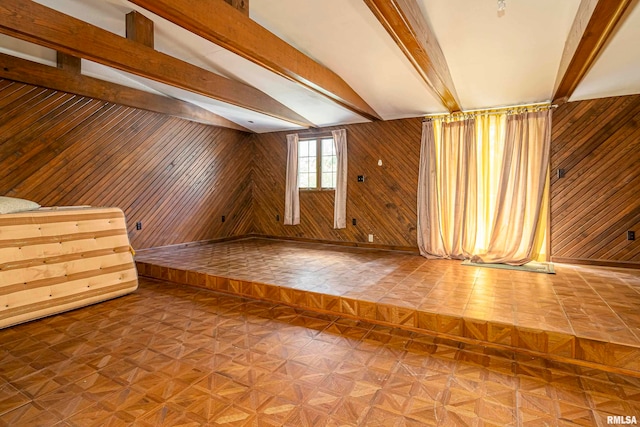 interior space featuring wood walls, parquet floors, and lofted ceiling with beams