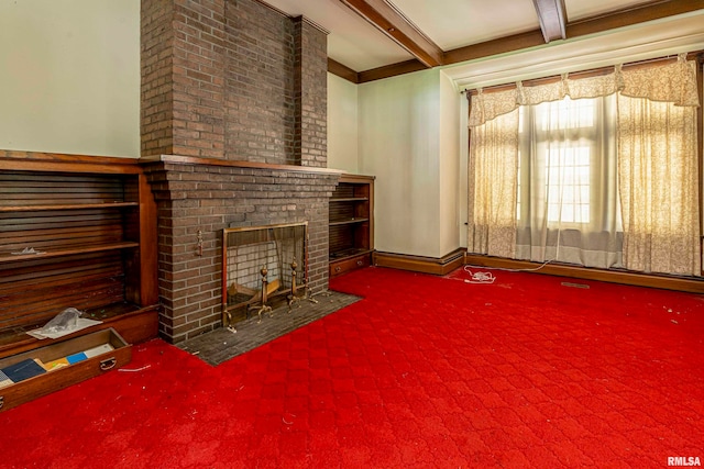 unfurnished living room featuring a brick fireplace, beam ceiling, and carpet floors