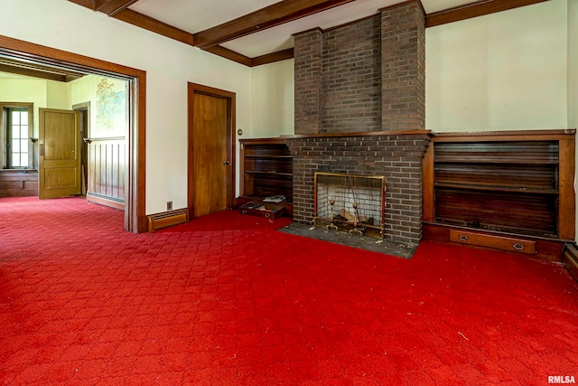 unfurnished living room with a fireplace, beamed ceiling, carpet flooring, ornamental molding, and a baseboard heating unit