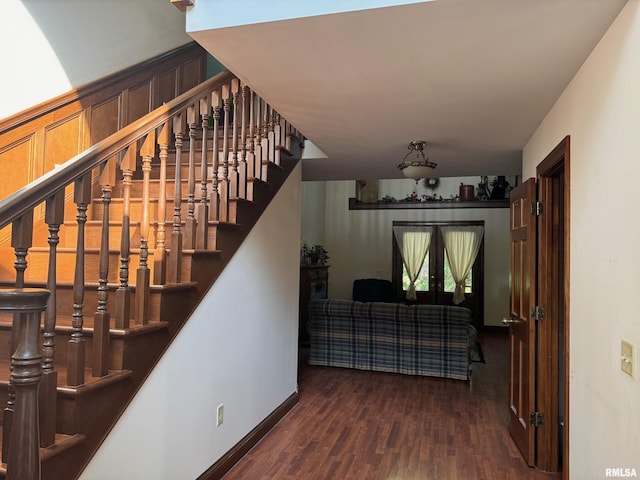 stairway featuring hardwood / wood-style flooring