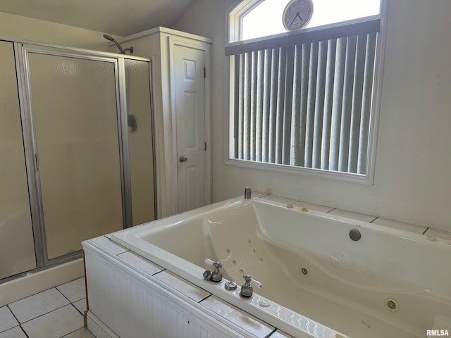 bathroom featuring plus walk in shower and tile patterned flooring