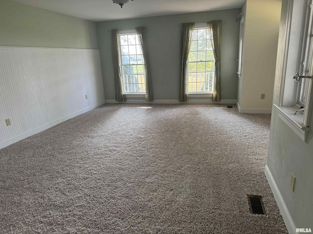 spare room with carpet floors