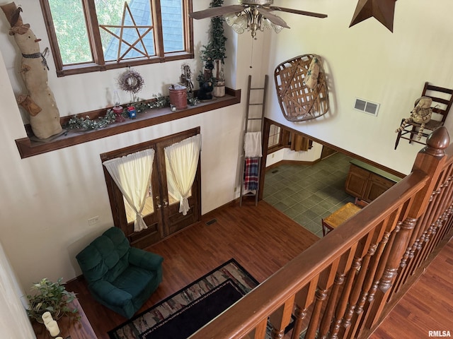 interior space featuring wood-type flooring and ceiling fan