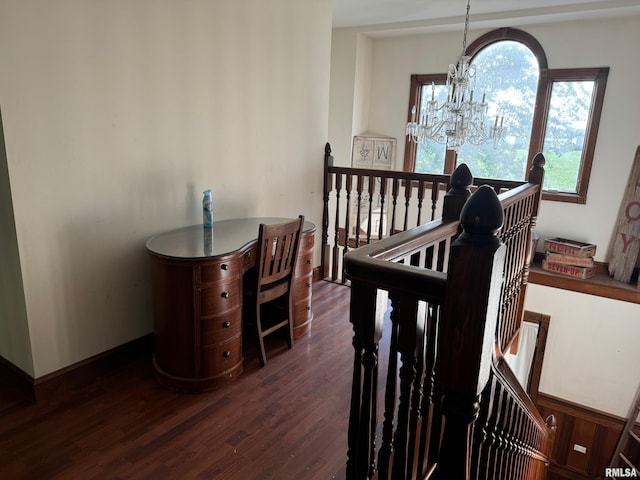 bedroom with dark wood-type flooring and a notable chandelier