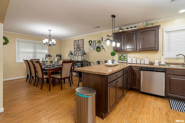 kitchen with dishwasher, hanging light fixtures, light wood-type flooring, dark brown cabinets, and a chandelier