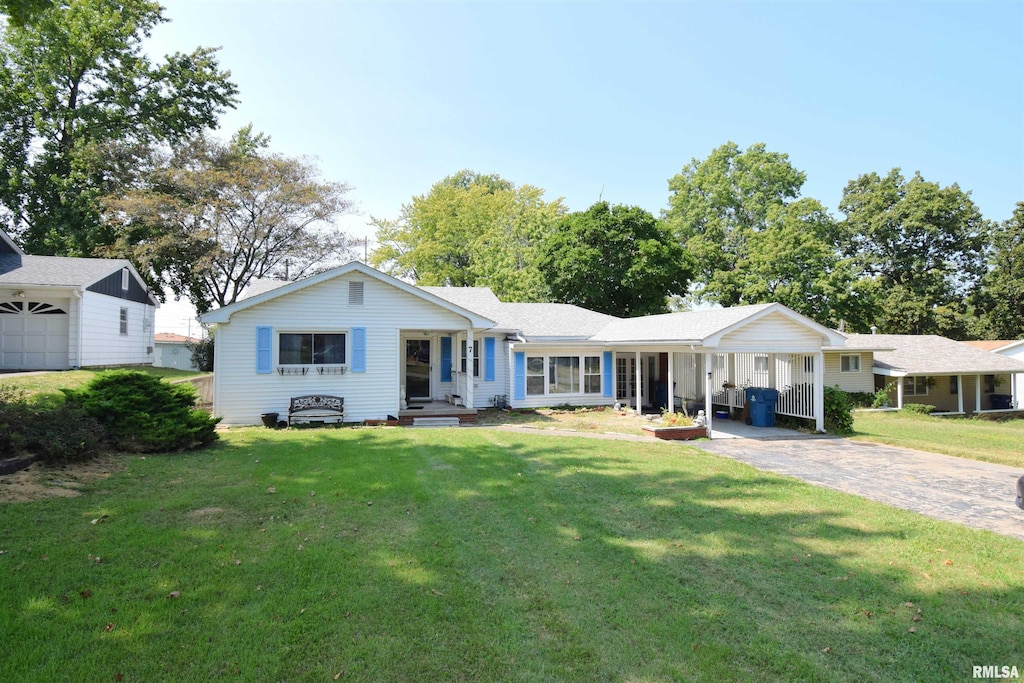 ranch-style home featuring a porch, a garage, and a front lawn