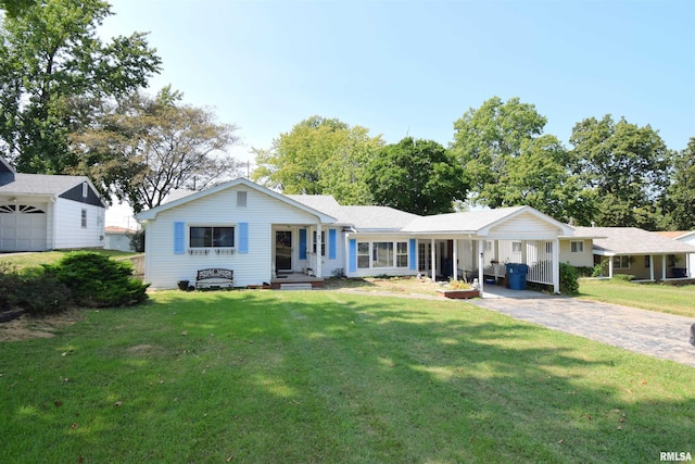 ranch-style home featuring a porch, a garage, and a front lawn