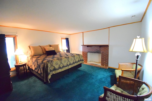 carpeted bedroom featuring a fireplace and crown molding