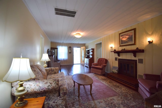 living room with wood ceiling and dark wood-type flooring