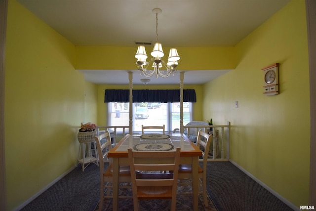 carpeted dining space with a notable chandelier