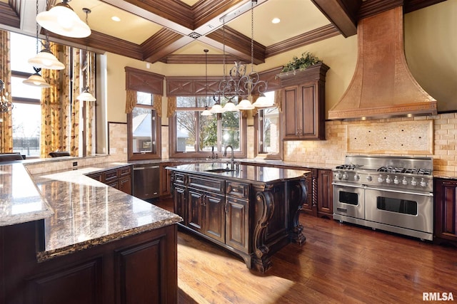 kitchen featuring decorative backsplash, custom exhaust hood, a notable chandelier, stainless steel appliances, and dark wood-style flooring