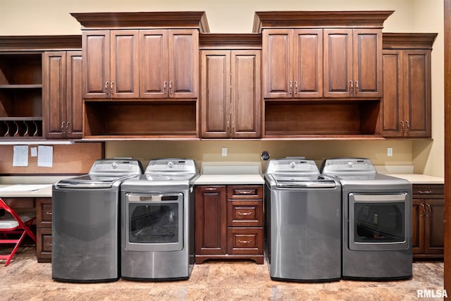 laundry room with independent washer and dryer and cabinets