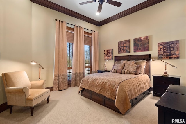 carpeted bedroom featuring ceiling fan and crown molding