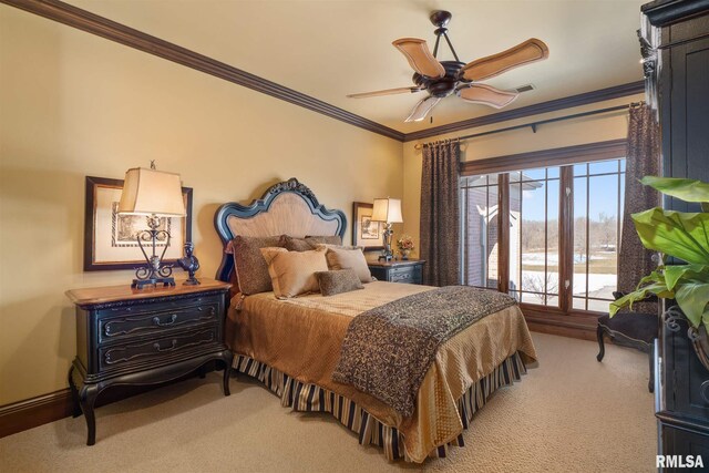 carpeted bedroom featuring ceiling fan and ornamental molding