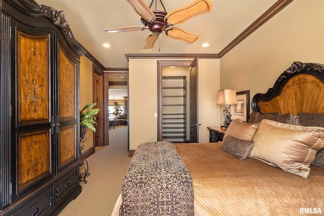 carpeted bedroom with ornamental molding and ceiling fan