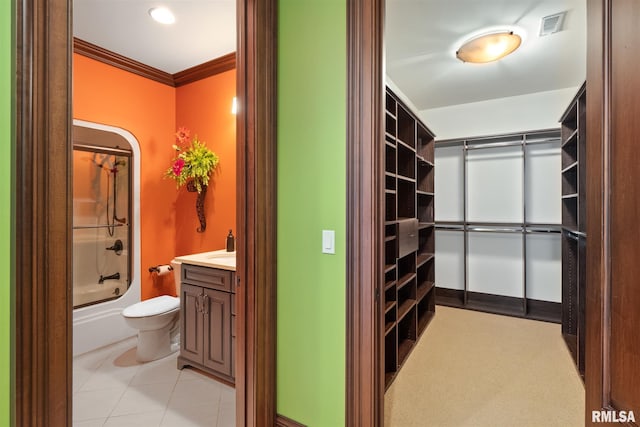 spacious closet featuring light tile patterned floors