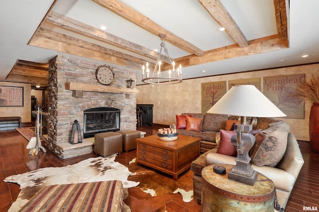 living room featuring an inviting chandelier, dark wood-type flooring, beamed ceiling, and a fireplace