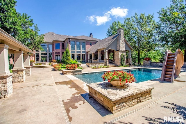 view of pool featuring a patio area