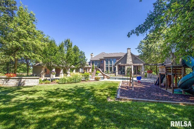 view of yard with a playground, a gazebo, and a swimming pool