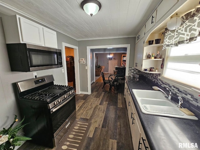 kitchen with sink, tasteful backsplash, white cabinetry, appliances with stainless steel finishes, and dark hardwood / wood-style flooring