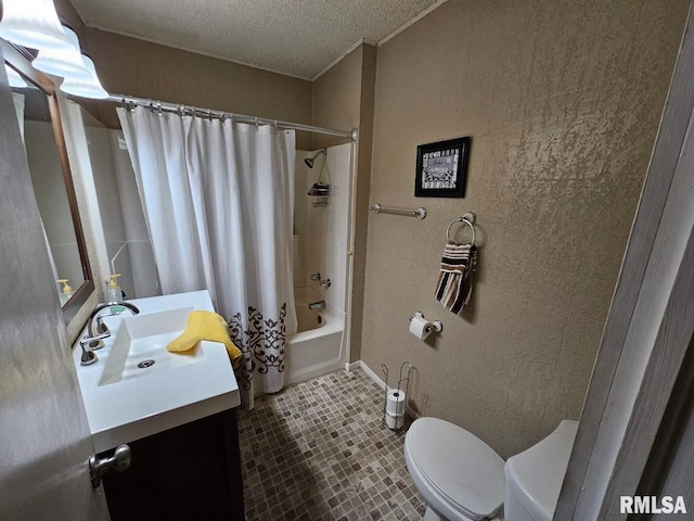 full bathroom featuring vanity, a textured ceiling, tile patterned flooring, shower / tub combo with curtain, and toilet