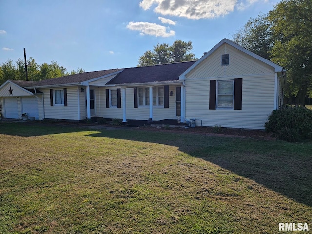 single story home featuring a garage and a front lawn