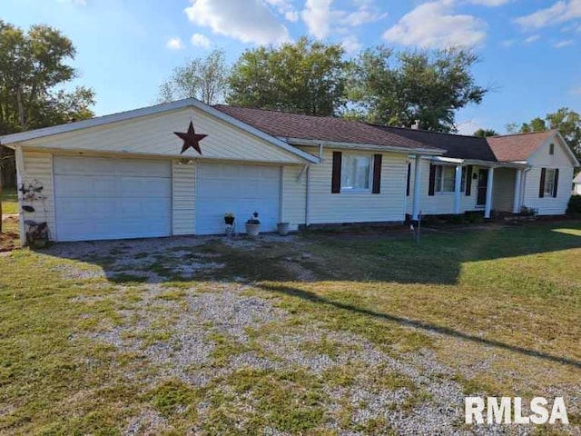 ranch-style home with a front yard and a garage