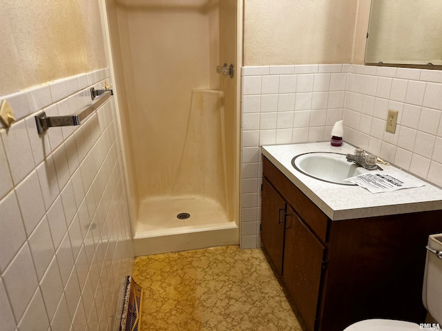 bathroom featuring tile walls, vanity, tile patterned flooring, a shower with shower curtain, and toilet