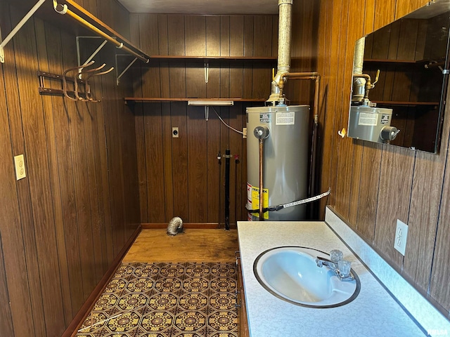 utilities featuring gas water heater and sink