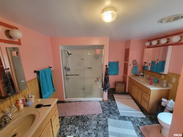 bathroom with vanity, toilet, and an enclosed shower