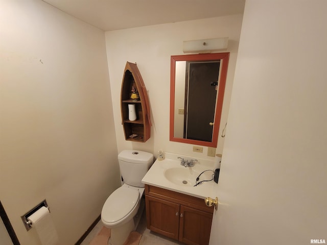 bathroom featuring vanity, toilet, and tile patterned floors