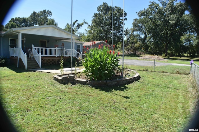 view of yard with ceiling fan