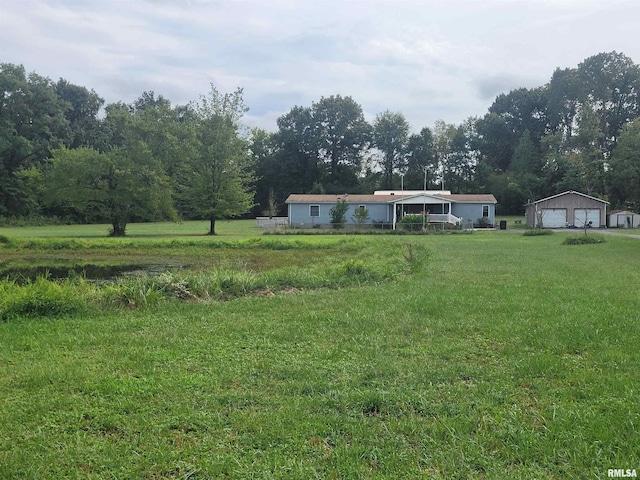 view of yard with a rural view