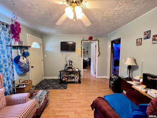 living room with light wood-type flooring and ceiling fan