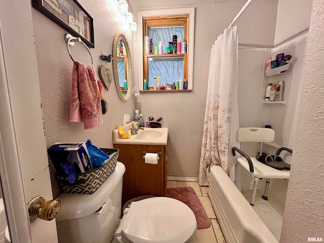 full bathroom with tile patterned flooring, vanity, toilet, and shower / bath combo with shower curtain