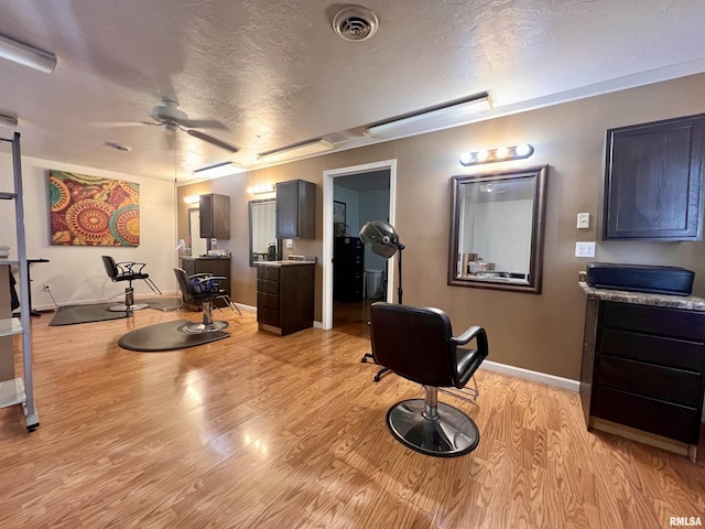 1106 N 11th St, Murphysboro, IL 62966 - interior space with a ceiling fan, light wood finished floors, a textured ceiling, baseboards, and visible vents