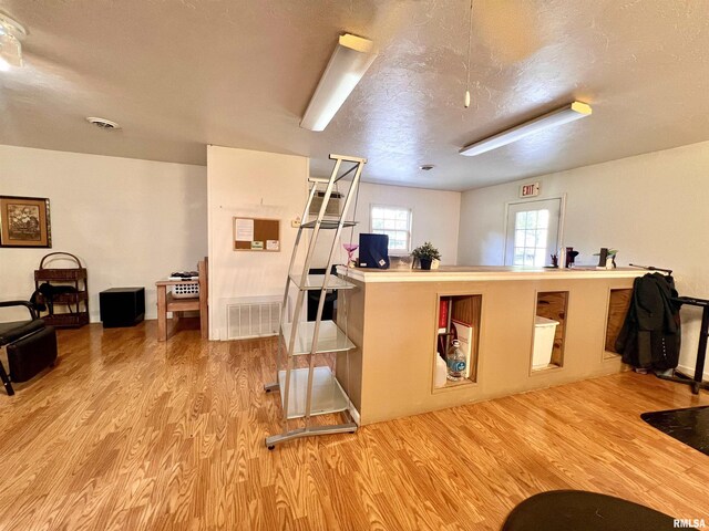 1106 N 11th St, Murphysboro, IL 62966 - kitchen featuring visible vents, a textured ceiling, and wood finished floors