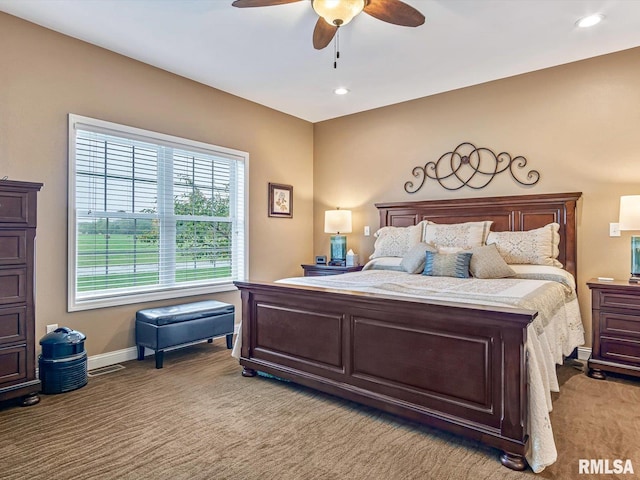 bedroom with ceiling fan and light colored carpet